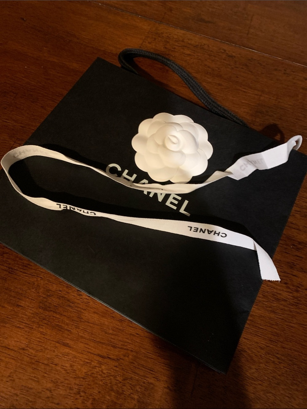 Authentic smaller size Chanel paper bag with camellia and authentic ribbon